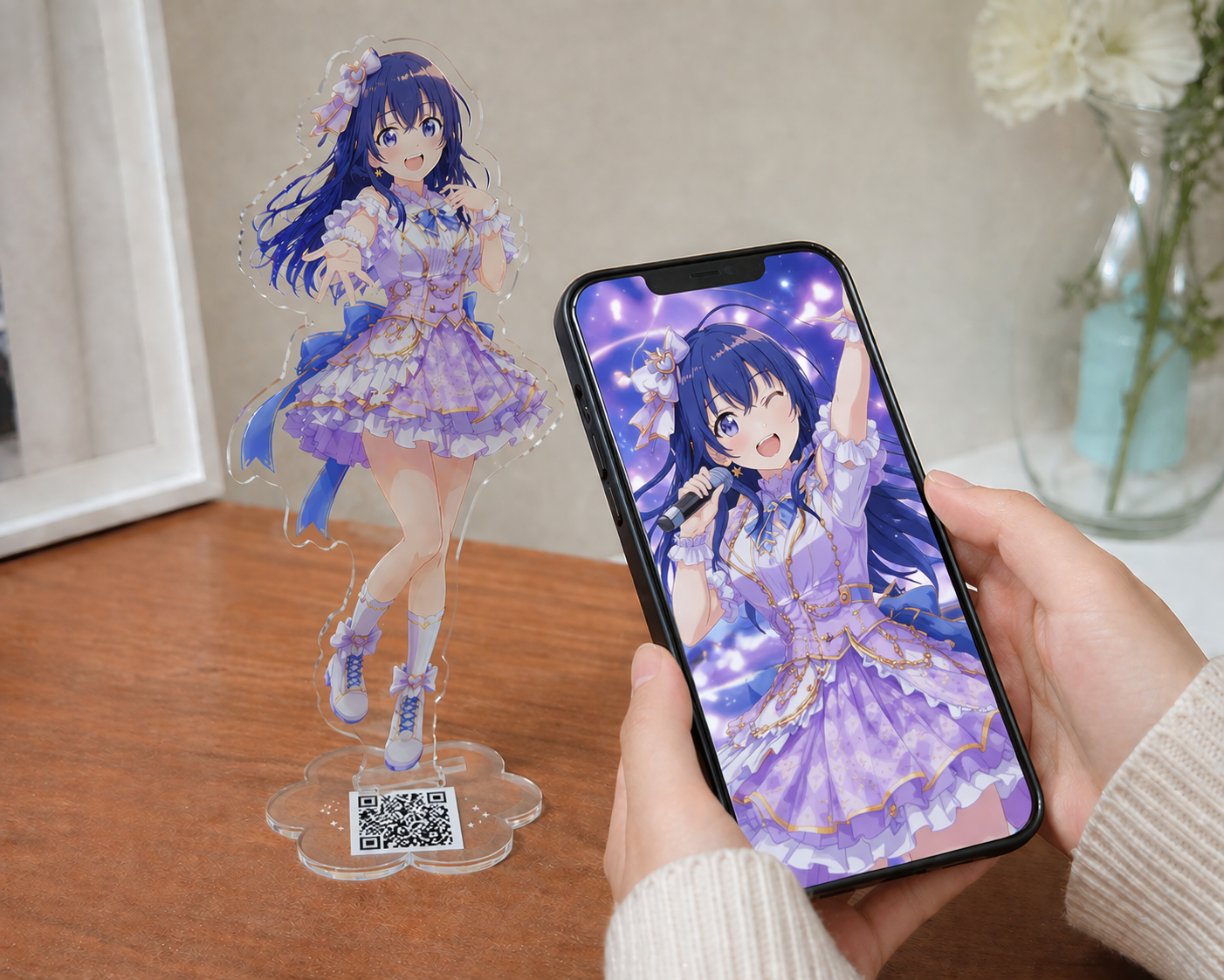 アクリルスタンドのQRコードにスマホをかざして写真を再生するイメージ